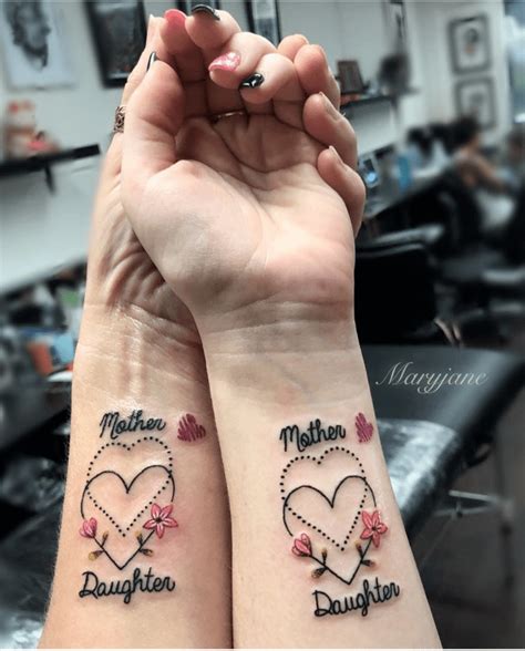 mom tattoos on wrist|mother daughter arm tattoo.